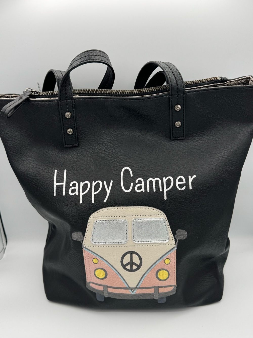 The Sak Palisade Happy Camper Reversible Black Tote Bag with VW Bus Peace Sign